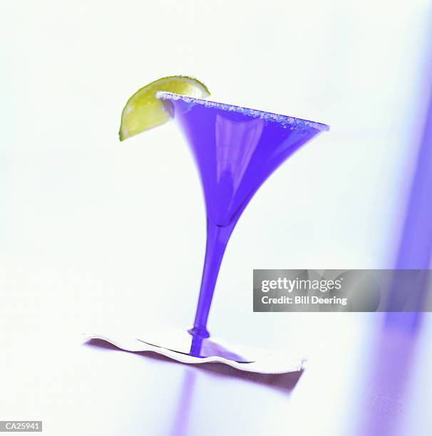 blue margarita glass with salt and lime - cocktail glass salt stock pictures, royalty-free photos & images