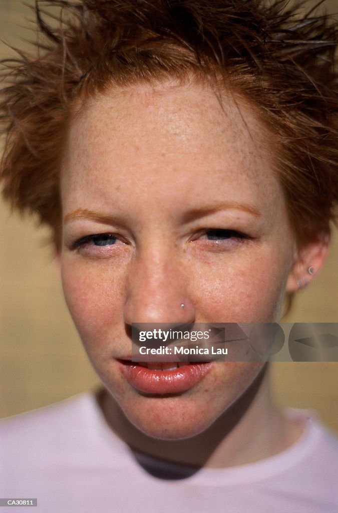 YOUNG WOMAN WITH RED HAIR, CLOSE-UP