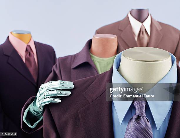 female mannequin's hand resting on male suit shoulder - moda extraña fotografías e imágenes de stock