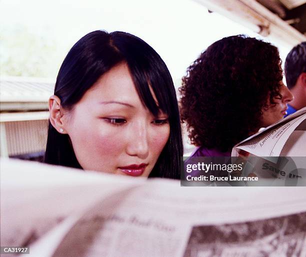 commuters reading newspapers - eslavos do leste imagens e fotografias de stock