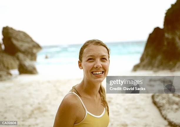 young woman smiling on beach - islas del atlántico fotografías e imágenes de stock