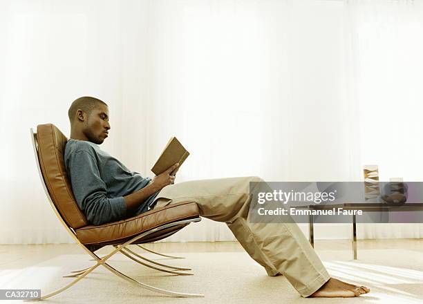 man reading book - emmanuel stock pictures, royalty-free photos & images