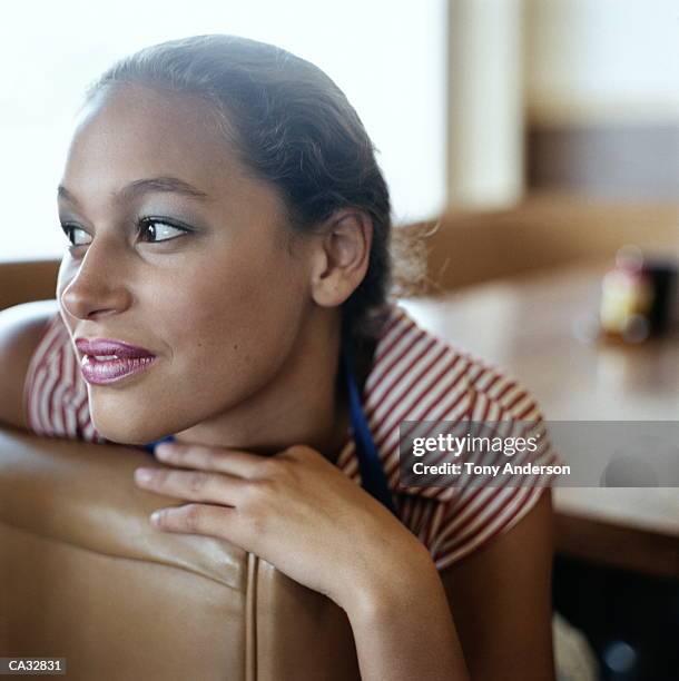 young waitress in diner booth, portrait, close-up - waitress booth stock pictures, royalty-free photos & images