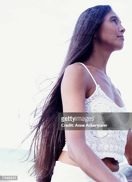 woman with long hair outdoors, profile - facing things head on stock pictures, royalty-free photos & images