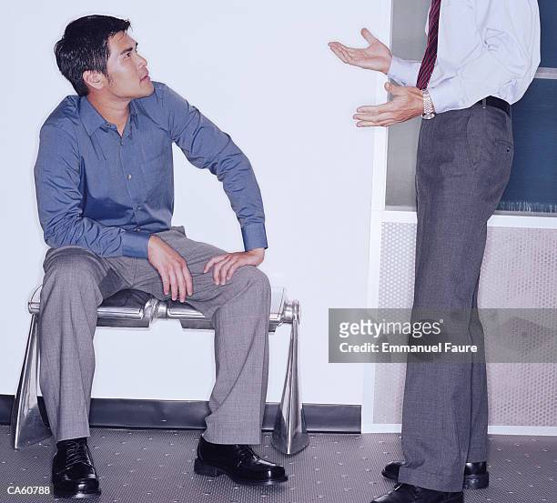 two businessmen talking - emmanuel stock pictures, royalty-free photos & images