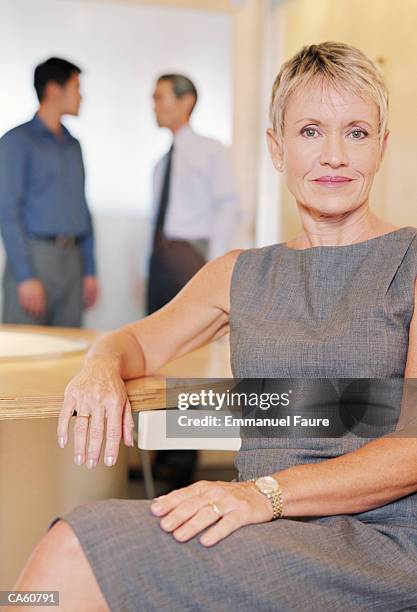 mature businesswoman in conference room, portrait - emmanuel stock pictures, royalty-free photos & images