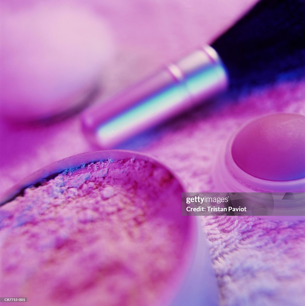 Make-up powder and brush, close-up (brightly lit)