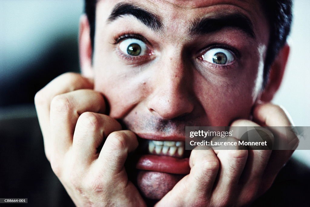 Man with scared expression, close-up