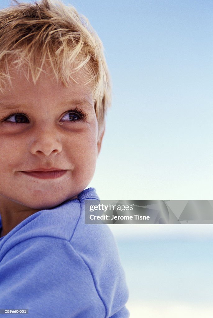 Boy (4-6 years) smiling, close-up, portrait