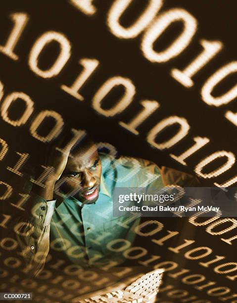 confused man working on a computer - glaring meaning stock pictures, royalty-free photos & images