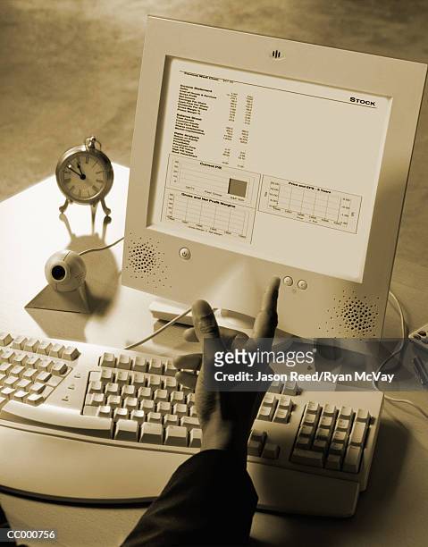 hand pointing at a computer monitor - ergonomic keyboard stock pictures, royalty-free photos & images