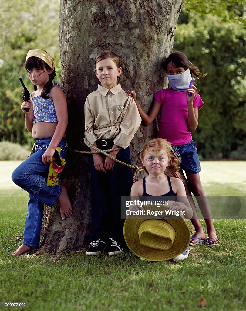 Group of children playing robbers and sheriffs