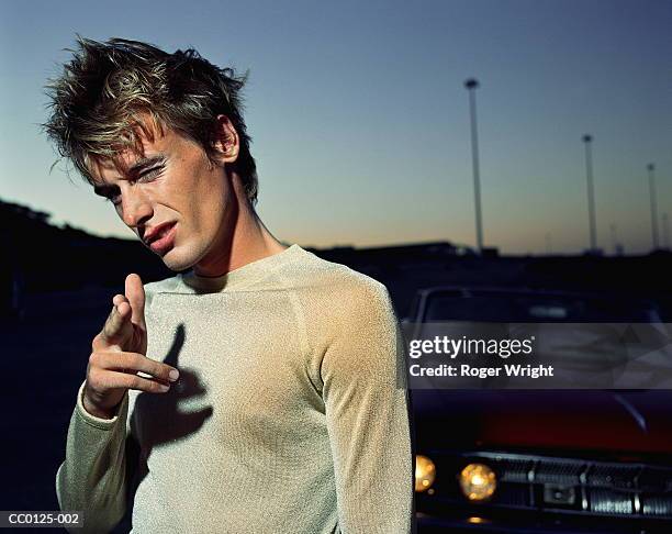 man pointing fingers as gun at camera, portrait - finger guns man stock pictures, royalty-free photos & images