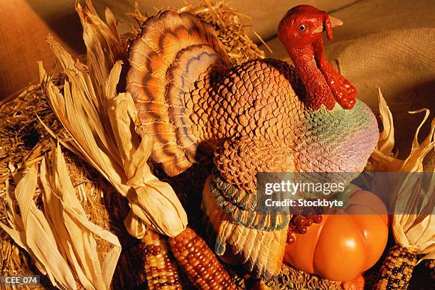 ceramic turkey surrounded by harvest vegetables - indian corn stock-fotos und bilder