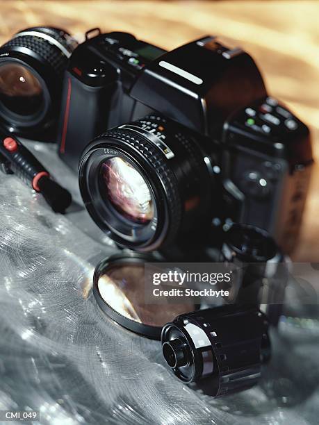 camera, lenses, and film canister - film canister stock pictures, royalty-free photos & images