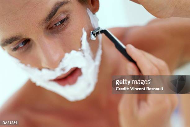 man shaving, close-up - shaving cream stock-fotos und bilder