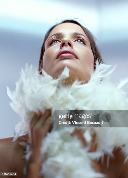 young woman wearing feather boa around neck, close-up - feather boa 個照片及圖片檔