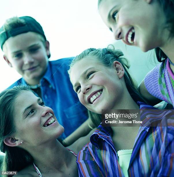 group of teenager (11-13) smiling, low angle view, close-up - girl 11 12 laughing close up foto e immagini stock