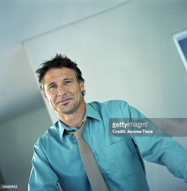 man wearing shirt and tie indoors, portrait - skjorta och slips bildbanksfoton och bilder
