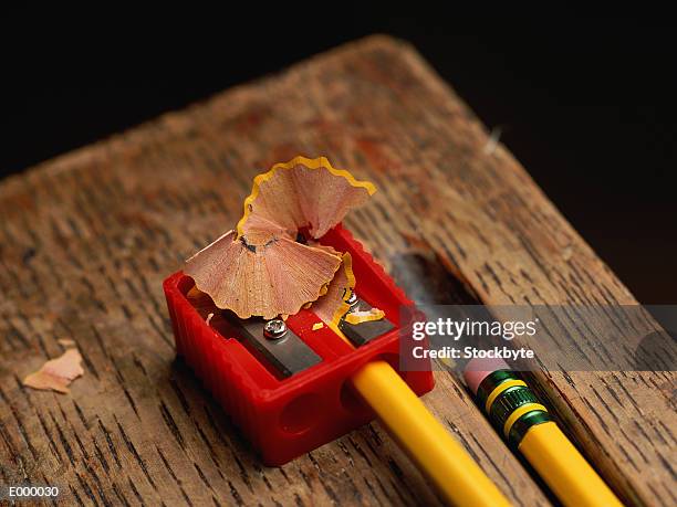plastic pencil sharpener, with pencil and shavings - pencil shavings stock pictures, royalty-free photos & images