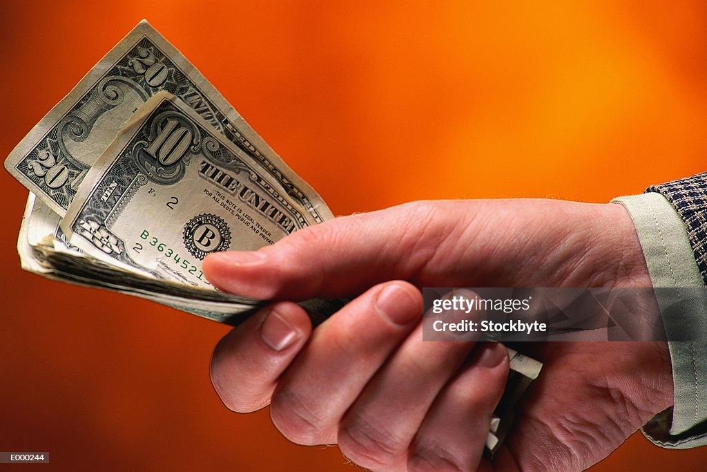 Hand holding money