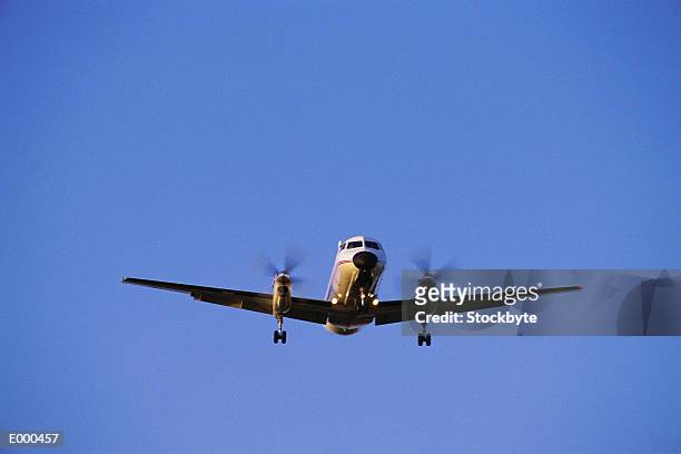 plane ascending - propeller plane stock-fotos und bilder