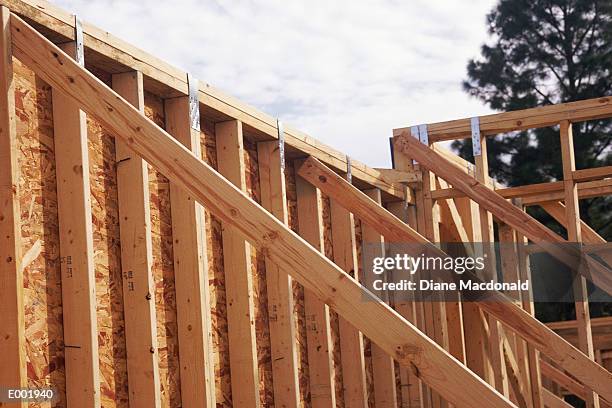 close-up of stacked beams and metal tabs - tabs stockfoto's en -beelden