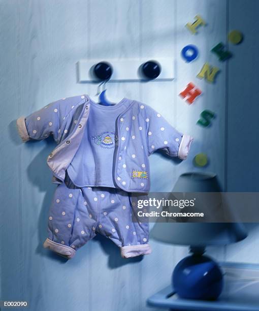 outfit of child's clothing hanging from peg - peg stock pictures, royalty-free photos & images