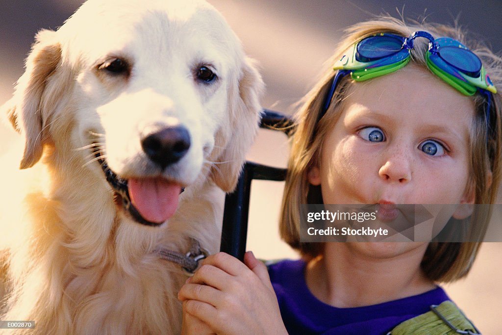 Girl Pulling Funny Face While Sitting Next To Dog High-Res Stock Photo -  Getty Images