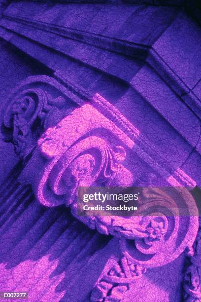 closeup of ornate capital in purple cast - volut bildbanksfoton och bilder