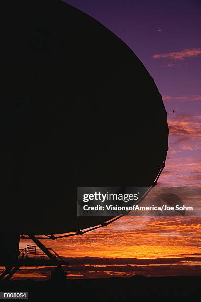 array/satellite dish in twilight - satellite dish stock-fotos und bilder