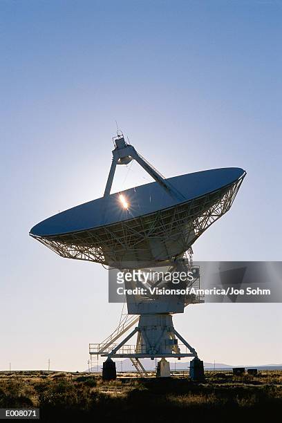array/satellite dish against blue sky - satellite dish stock-fotos und bilder