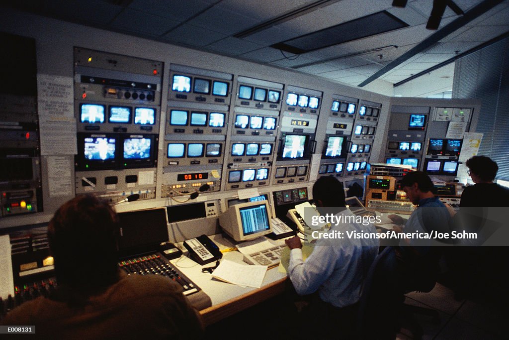 People in control room.