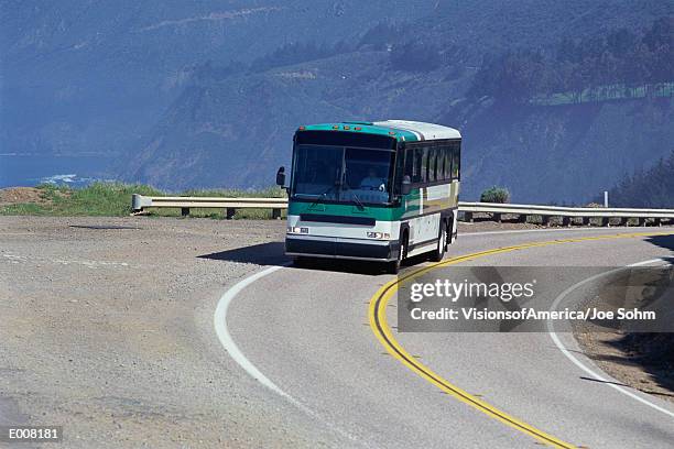 bus rounding curve on road - rounding stock pictures, royalty-free photos & images