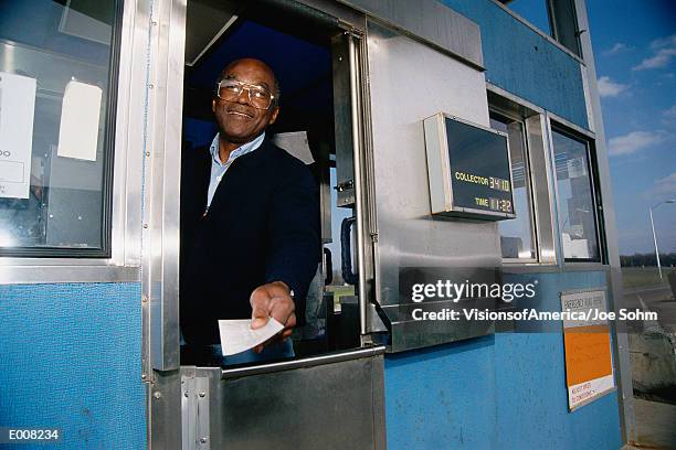 attendant at toll booth - pedaggio foto e immagini stock