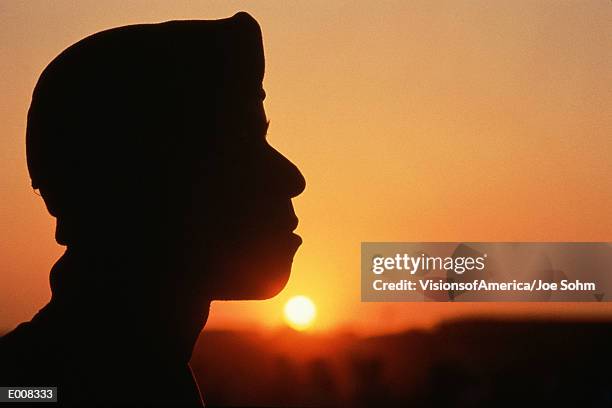 profile of soldier in front of sunset - soldier profile stock pictures, royalty-free photos & images