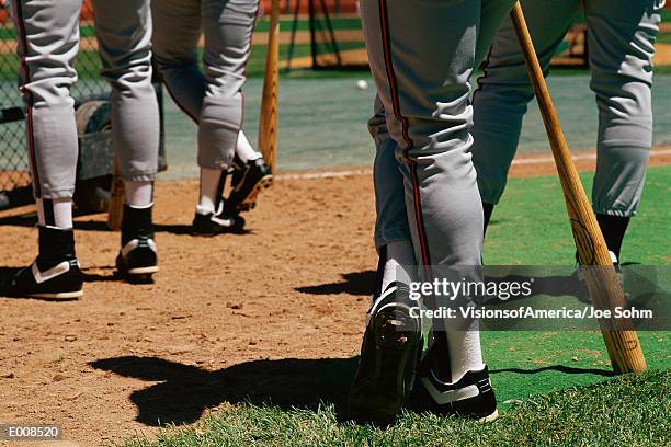 legs of baseball players - baseball cleats fotografías e imágenes de stock
