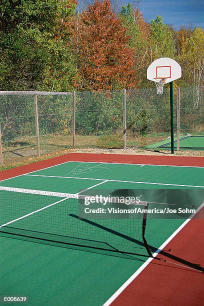 tennis court with basketball hoop - tennis court stock pictures, royalty-free photos & images