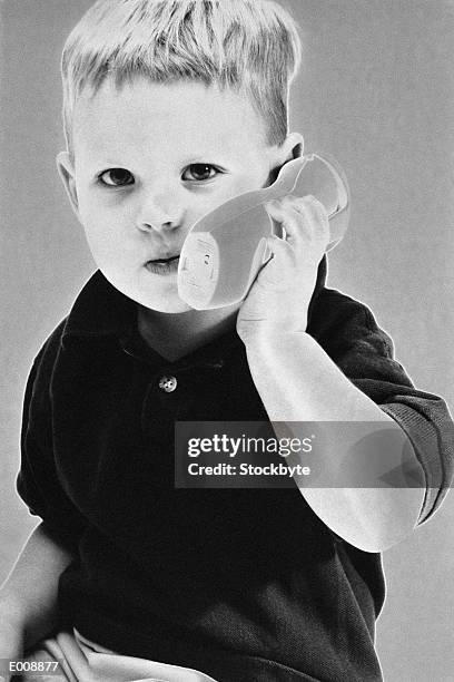 little boy on play telephone - solarisation bildbanksfoton och bilder