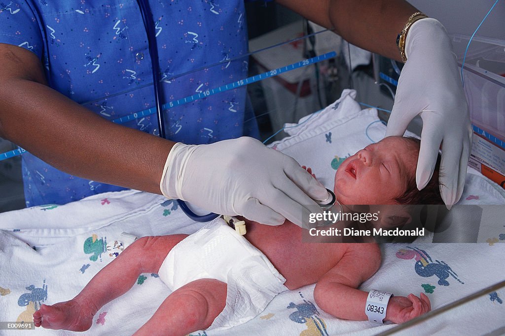 Nurse tending to newborn