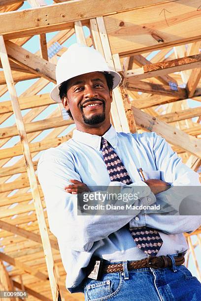 proud foreman standing in front of building - foreman stock pictures, royalty-free photos & images