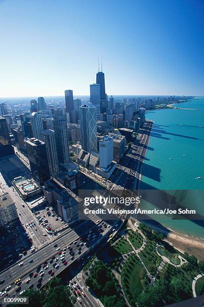 aerial view of chicago and lake michigan - vierbaansweg stockfoto's en -beelden