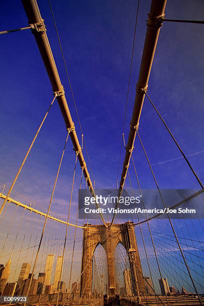 low angle view of brooklyn bridge cables - burberry and fox searchlight pictures honour the cast and filmmakers of brooklyn stockfoto's en -beelden