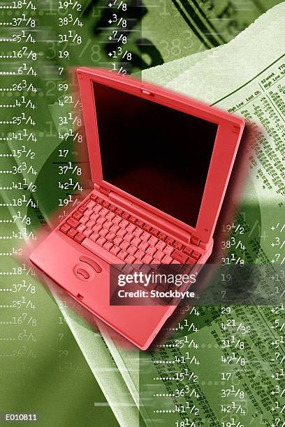 red laptop with stock quotes behind - share prices of consumer companies pushes dow jones industrials average sharply higher stockfoto's en -beelden