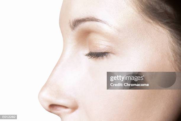 partial profile of caucasian female, eyes closed - human nose profile stock pictures, royalty-free photos & images