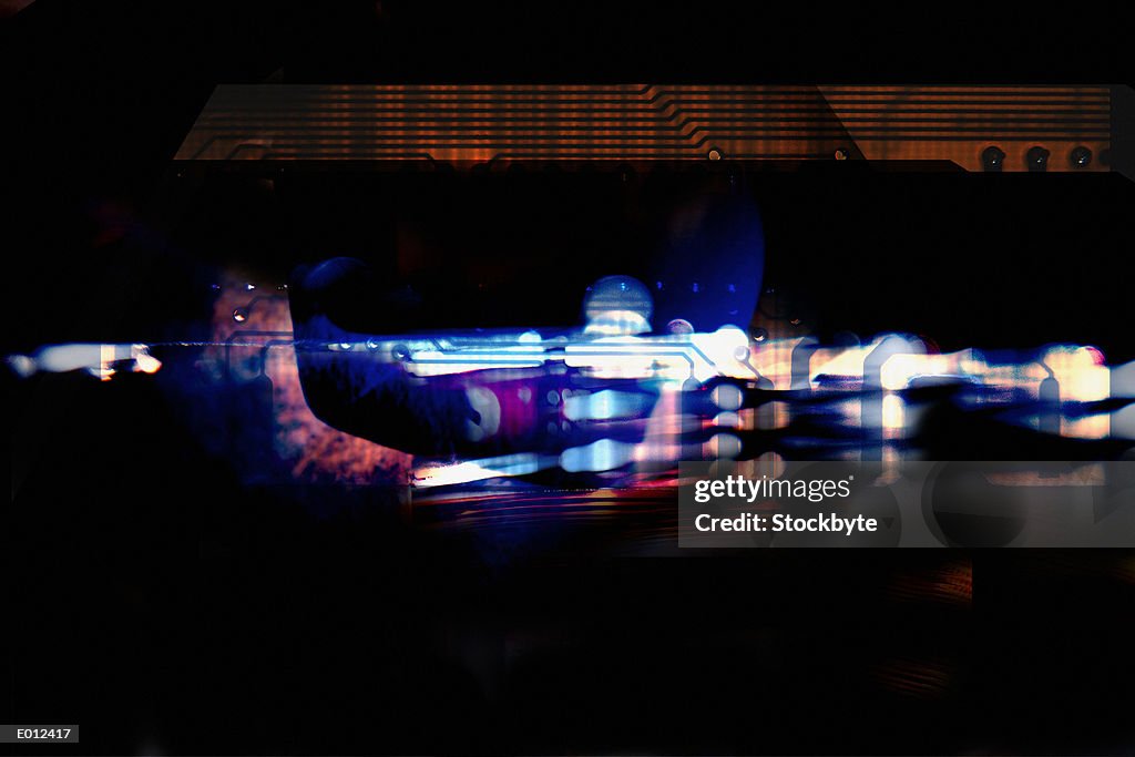 Blurred multicolored circuitry with dark overlay