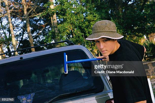 teenage boy washing car window - diane ストックフォトと画像