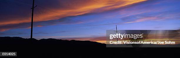 telephone poles at sunset - palmdale stockfoto's en -beelden