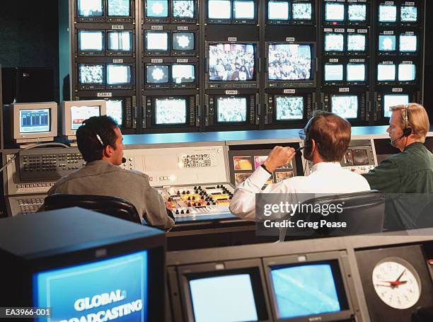 television broadcast control room with director and crew - broadcast control room stock pictures, royalty-free photos & images