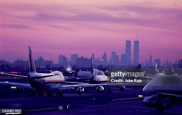 usa, new york city, jfk airport, aircraft taxiing at sunset - kennedy airport stock pictures, royalty-free photos & images